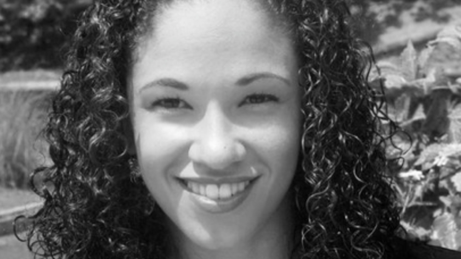 Black and white headshot of Kamal Sinclair