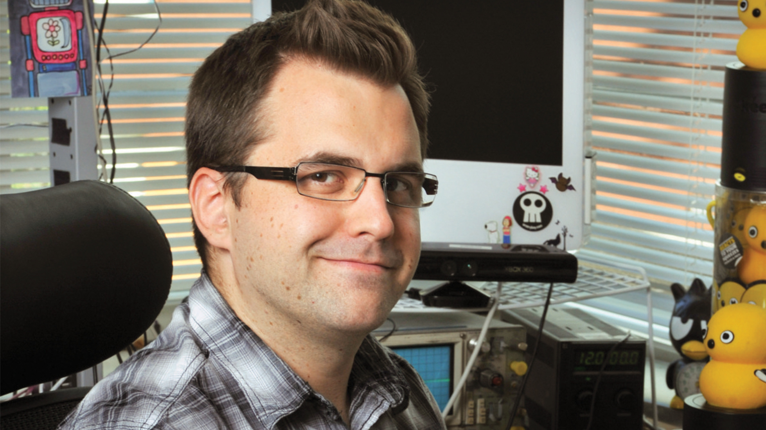 Photograph of Kyle Machulis sitting at a desk