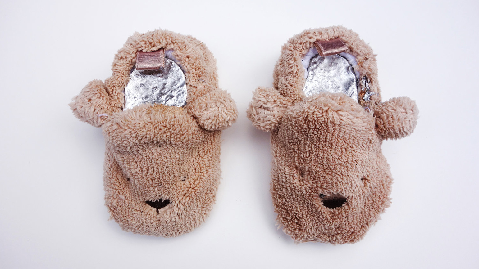 Slippers shaped like bears filled with a metal casting