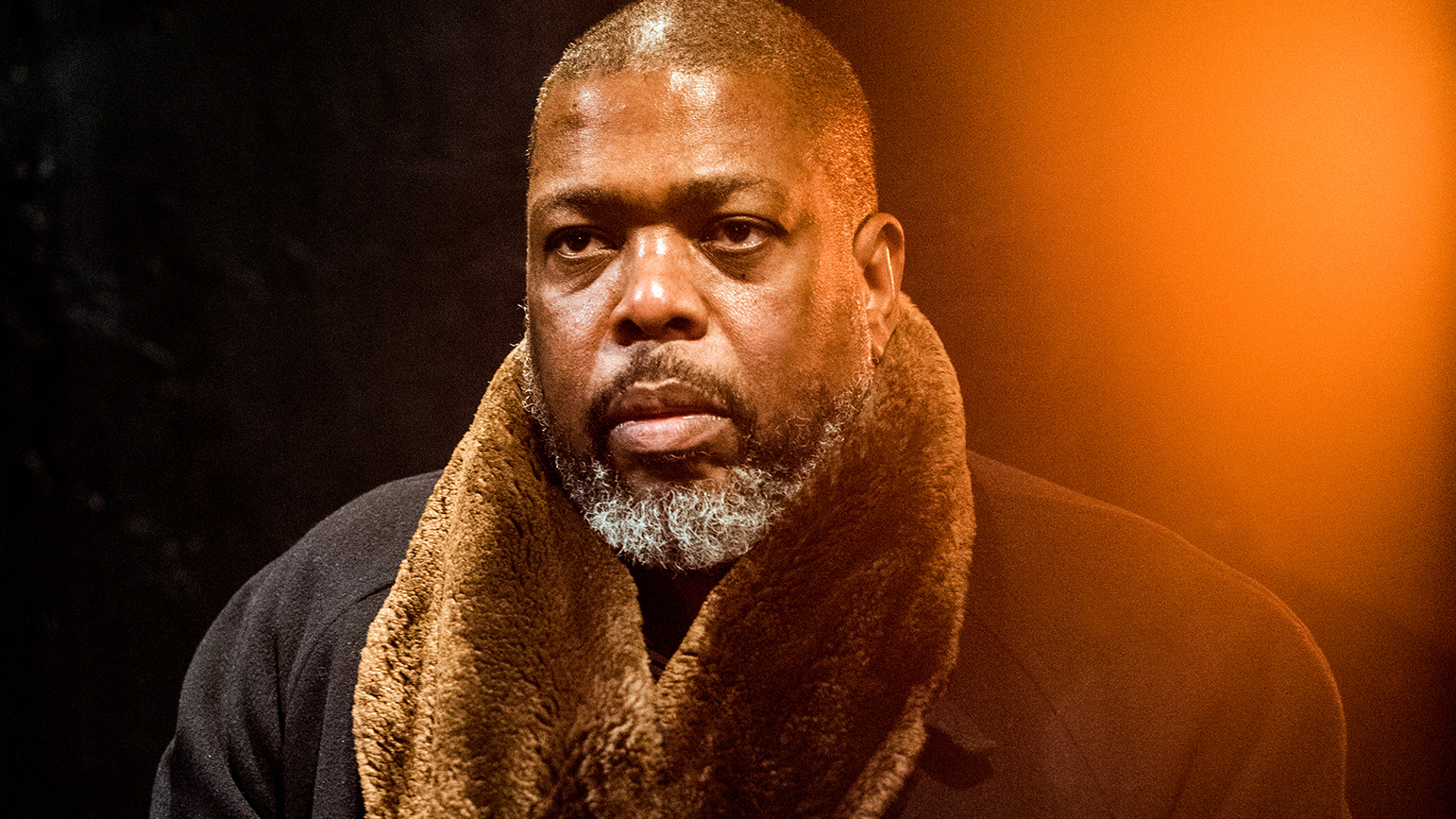 Headshot of a man in a coat